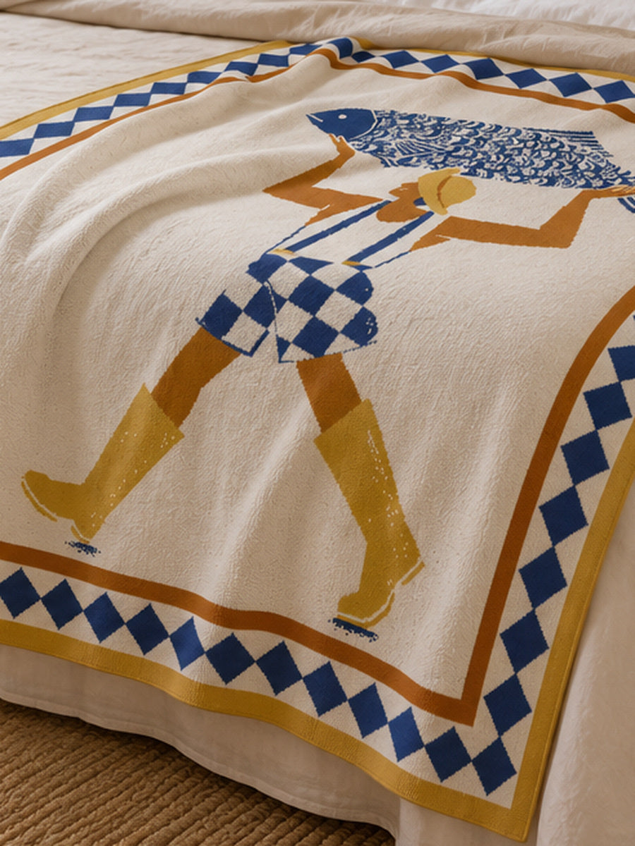 Biquette luxury knit throw blanket layered across the foot of a bed